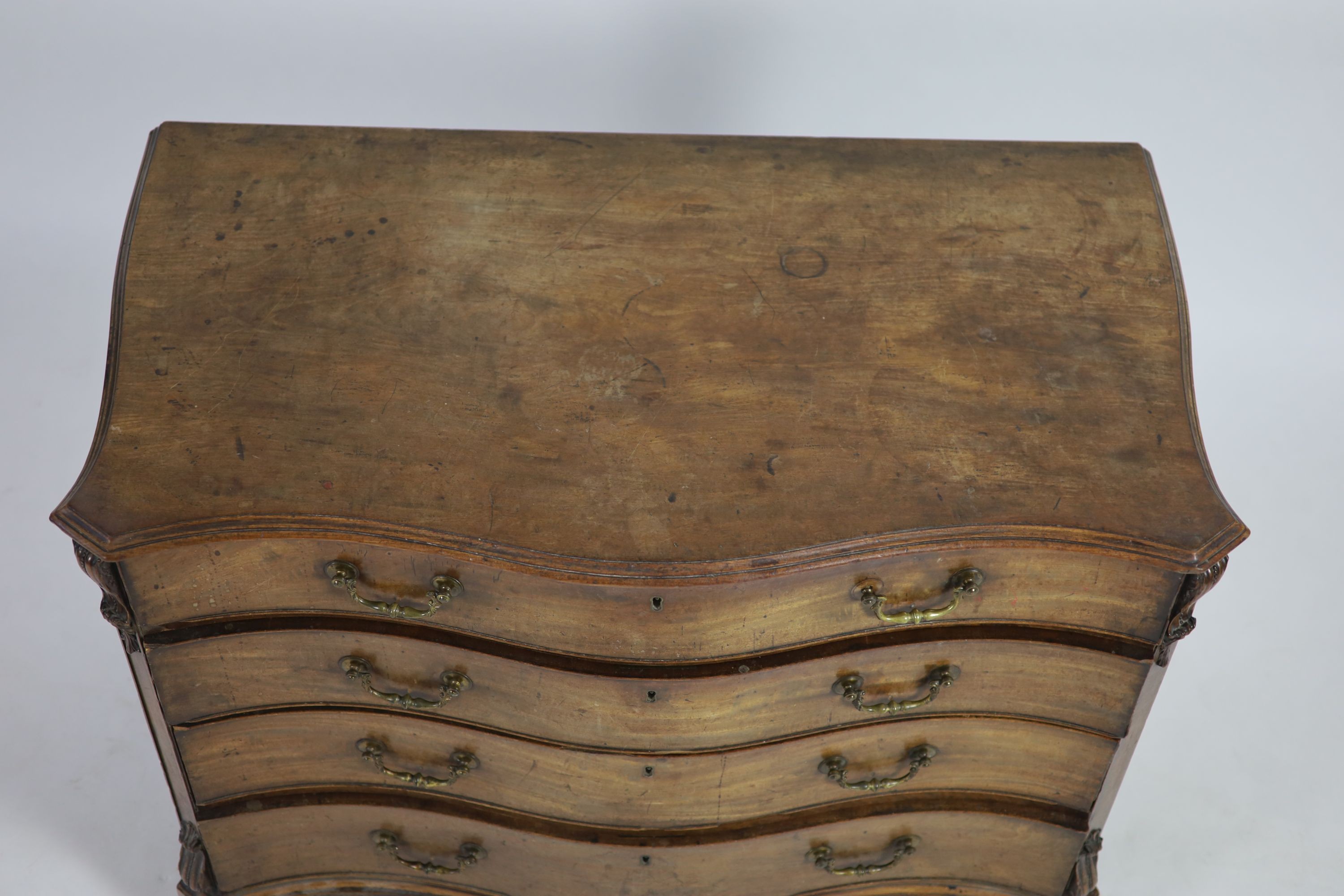 A George III Chippendale style mahogany serpentine commode W 112cm D 62cm H 83cm